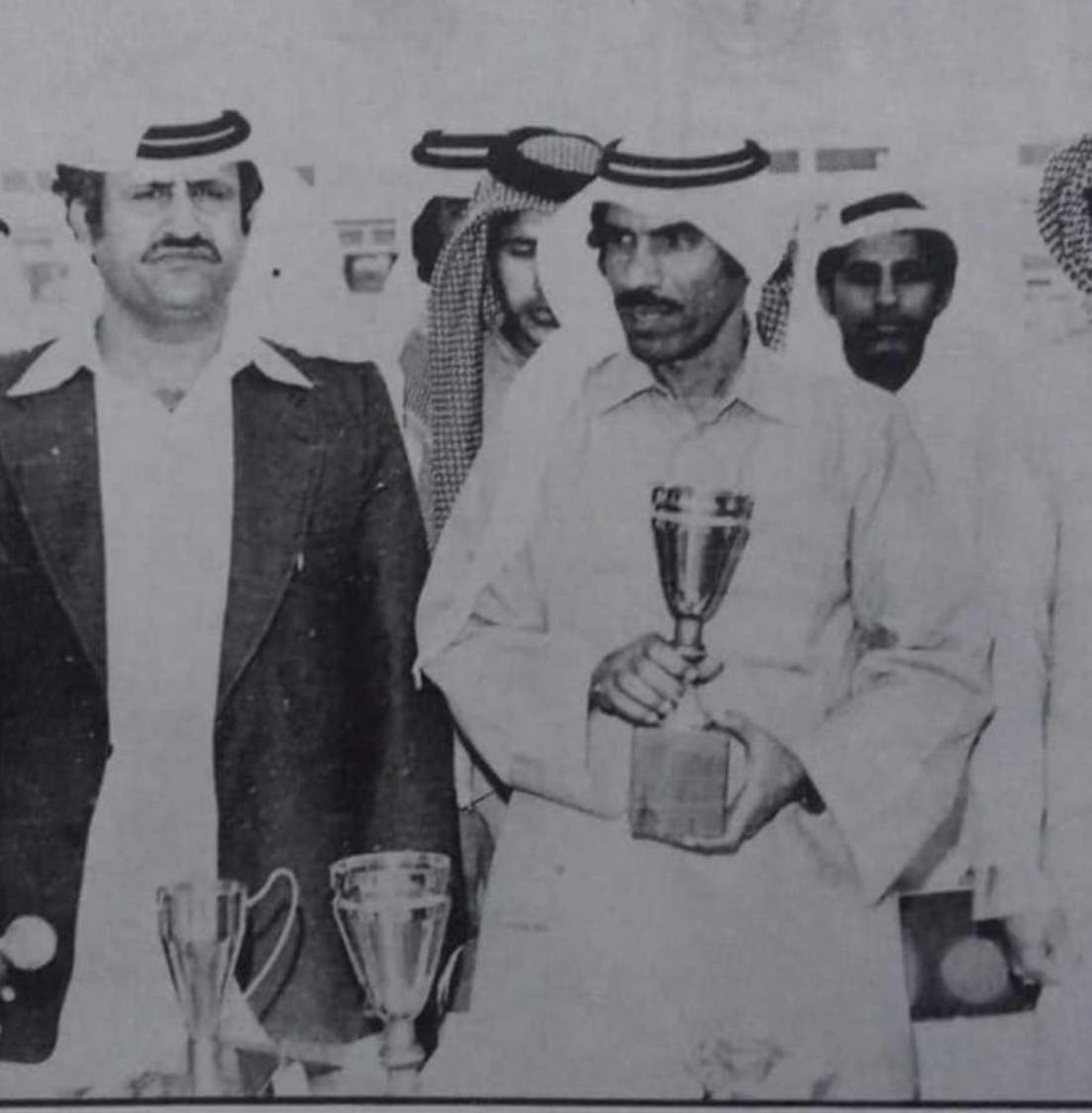 Archival photograph of Obaid Al Taboor among colleagues
